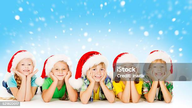 Christmas Children Santa Helper Hat Xmas Kids Boys And Girls Stock Photo - Download Image Now