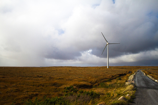 Wind turbine on a bog in Ireland. Shot in County Galway. Copy space in the sky.
