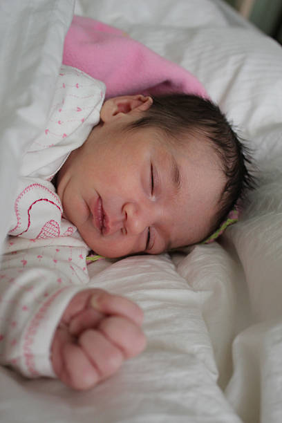 istock sleeping newborn baby girl 521822573