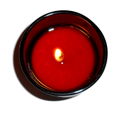 Isolated view from above of a mango scented tea light.