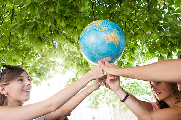 istock friends holding the world 521824429