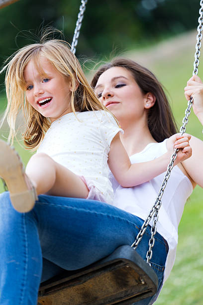 istock Mother and daughter having fun outdoors 521829713