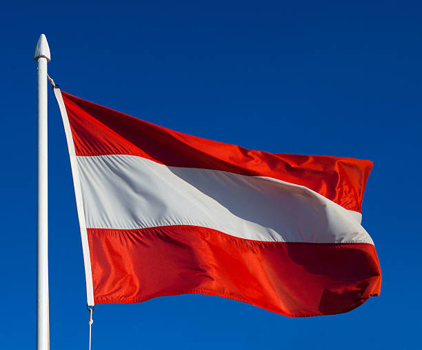 istock Flag of Austria against blue sky 521829795
