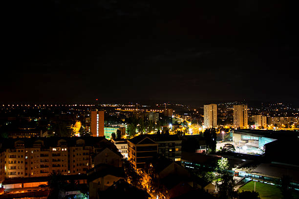 City landscape at night shot from the roof of the building