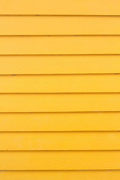 istock yellow wooden fence 521832955