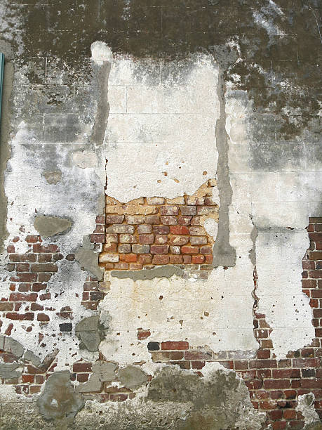 istock Architectural Textures of Old Brick and Patches of Stucco 521848139