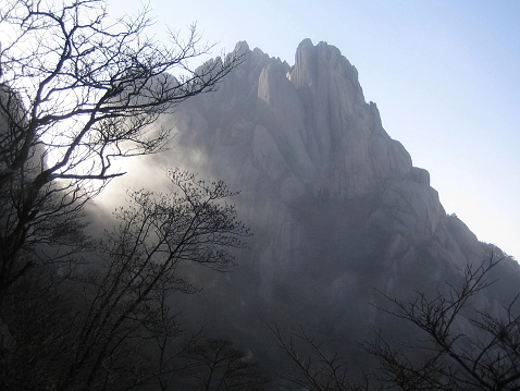 THe yellow mountrains in china hidden mist giving it a very mysterious look.