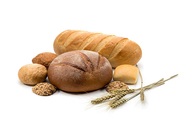 istock assortment of baked bread in basket on white background 521850013