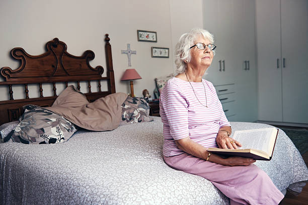 istock relaxing in bedroom reading book 521854299