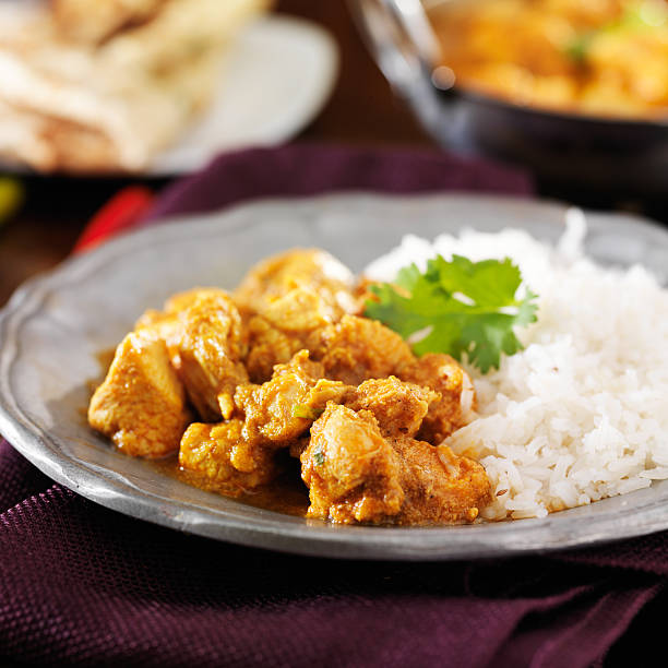 istock indian butter chicken curry with basmati rice 521854609