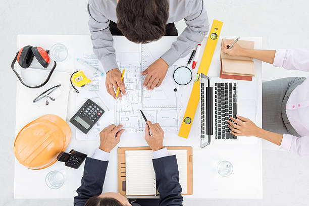 istock Discussing blueprint of the house 521855523