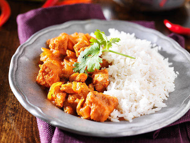 istock indian chicken vindaloo curry with basmati rice close up 521855601