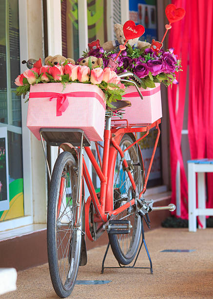 istock Beautiful of rose artificial flowers in bicycle 521869565