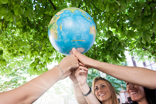 istock friends holding the world 521870005