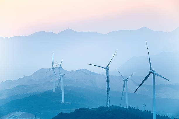 istock wind farm with blue hills silhouette 521870139