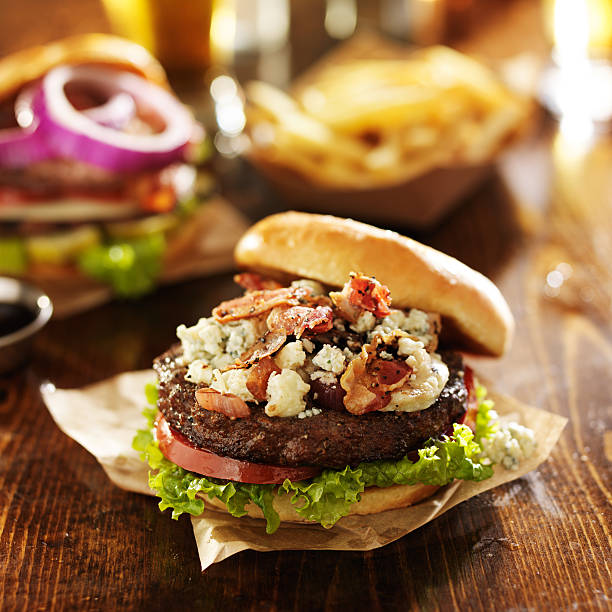 istock gourmet bacon and blue cheese burgers with beer 521870355
