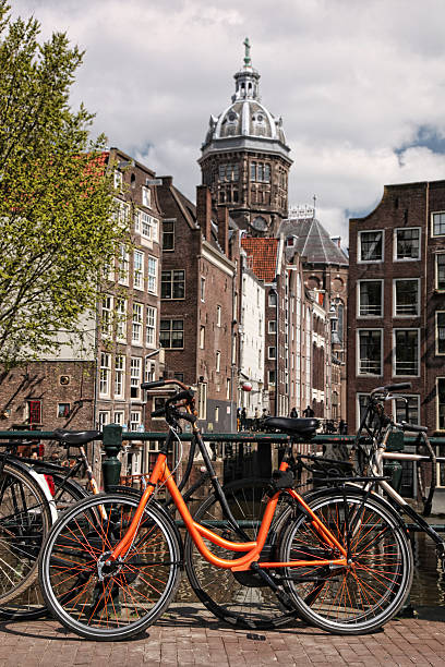 istock Amsterdam with old bicycles on the bridge against canal, Holland 521873377
