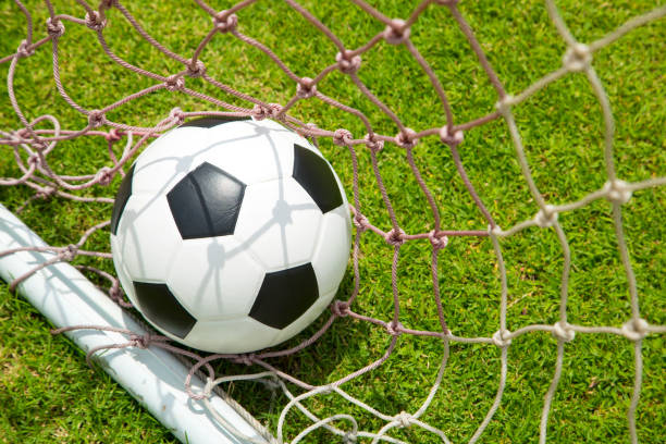 istock Soccer ball in the goal after shoot 521873975