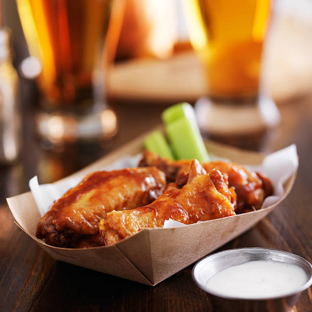 istock buffalo chicken wings in basket 521875613