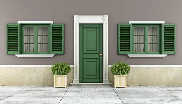 Detail of a classic house Detail of a classic house with green wooden windows and front door - rendering shutter door stock pictures, royalty-free photos & images