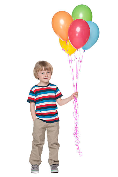 istock Cute little boy with balloons 521891355