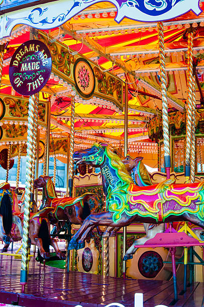 istock Carousel with horses on a carnival Merry Go Round 521892809