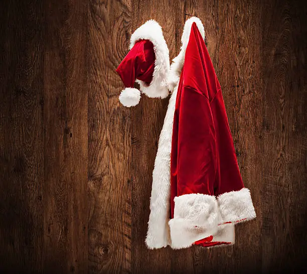 Santa costume hanging on a wooden wall shot with a tilt and a shift lens