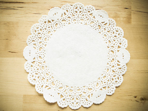 istock Lace paper on wooden table 521893963