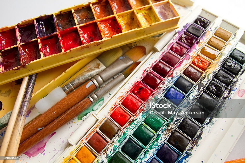 Close-up of watercolour sets with paintbrushes Close-up of watercolour sets with paintbrushes isolated on white background Art Stock Photo