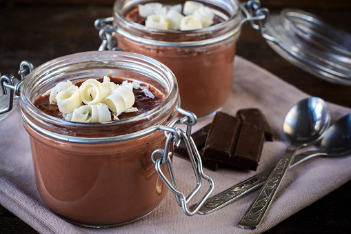 Homemade chocolate pudding in the jars,selective focus