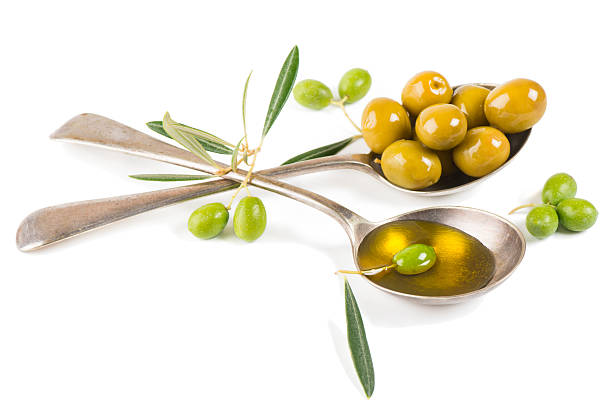 istock fresh olive oil and olives in a two spoons 521895203