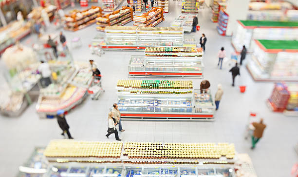 istock People shopping in a large supermarket 521895511
