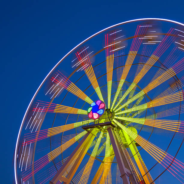istock Ferris Wheel Carousel on a dark blue sky background. 521906699