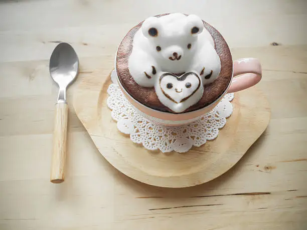 Bear hugging heart in coffee cup. Adorable latte art 3d design.
