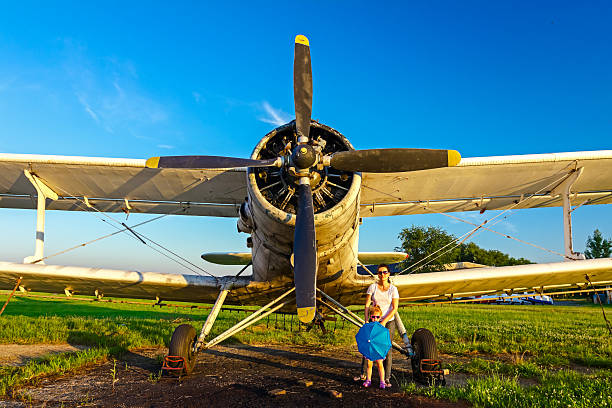 istock Double winged propeller silhouetted against a clear blue sky. 521910979