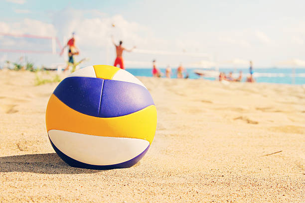 beach volleyball ball in sands close up of beach volleyball ball in sands volleying stock pictures, royalty-free photos & images