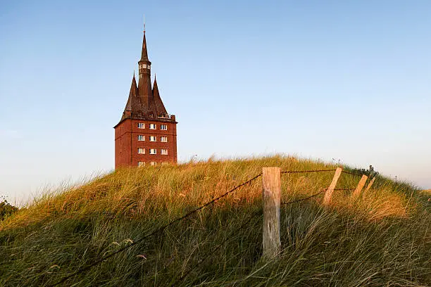 The west tower of the island of Wangerooge at sunset, Germany.