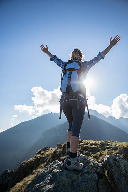 istock Victory at top of mountain peak 521912243