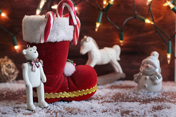 istock boots, rocking horse, and teddy bear on christmas background 521913243