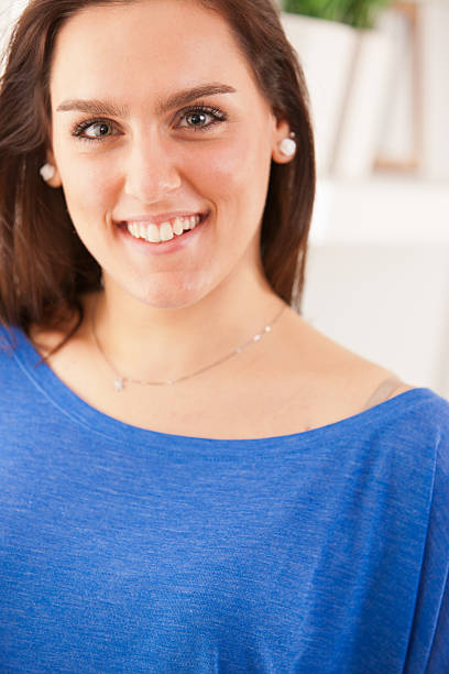 istock pretty smiling young woman with beautiful eyes 521929657