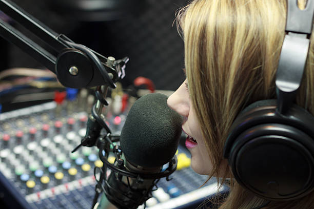 Radio DJ Beautiful Woman Working As Radio DJ Live In Studio radio dj stock pictures, royalty-free photos & images