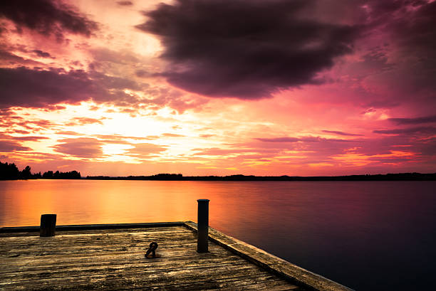 istock pier at lake and a beautiful sunset 521933139