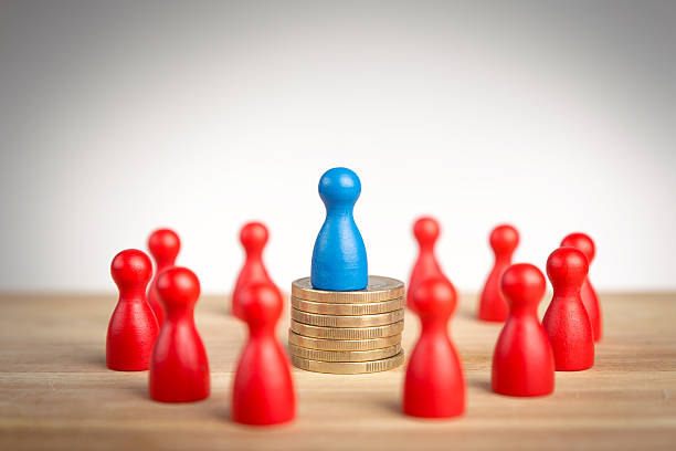 istock Rich business leader concept with blue figure on top 521934479