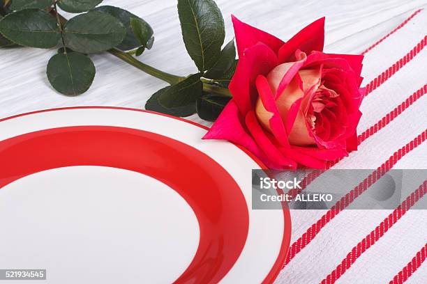 Festive Table Setting Flower Of Red Roses And A Plate Stock Photo - Download Image Now