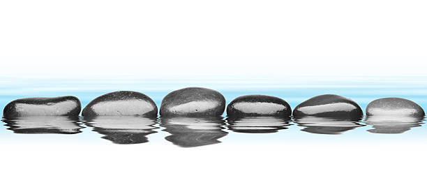 istock Water stones on isolated white background 521934605