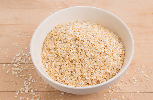 istock Quinoa flakes in a white bowl 521935123