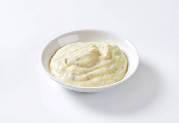 Creamy salad dressing Creamy salad dressing made of mayonnaise, buttermilk, garlic, herbs, spices and grated cheese ranch dressing stock pictures, royalty-free photos & images