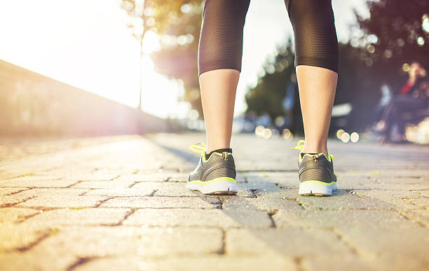 istock Female runner, feet closeup 521951591