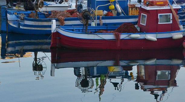 istock Pozzuoli, Naples. Boats' Reflections in water's harbor 521951827