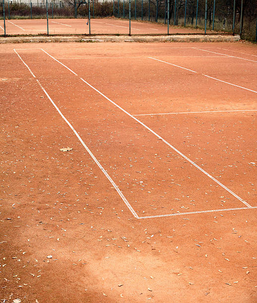 istock Empty tennis courts in autumn park 521951973